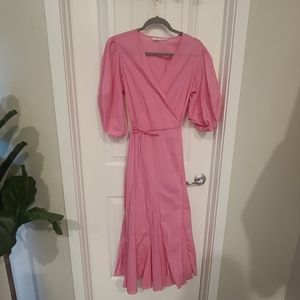 Rhode resort cotton wrap dress with pouf sleeve and ruffle hem in pink.